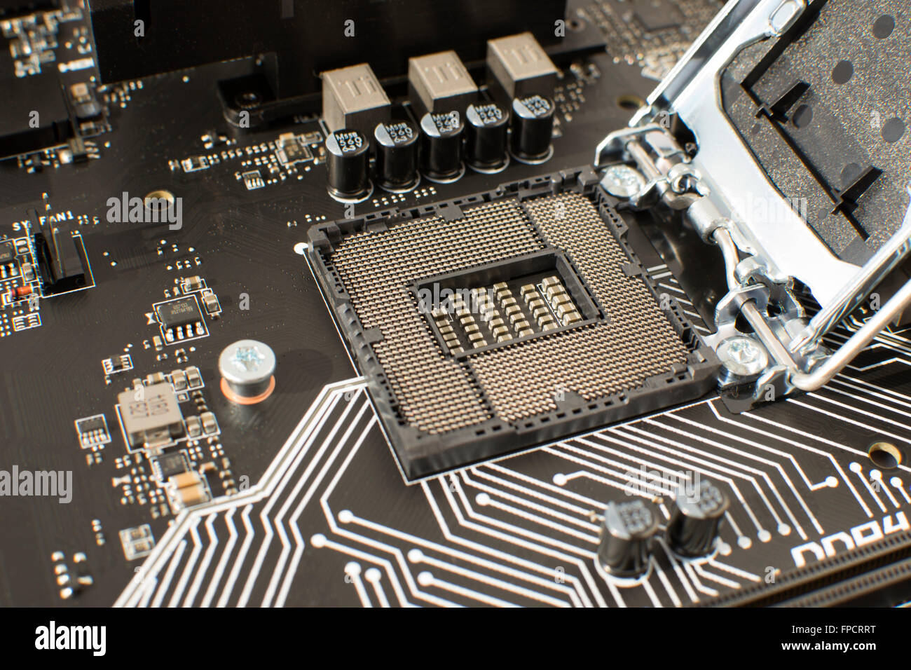 Computer Motherboard with empty and open CPU socket Stock Photo