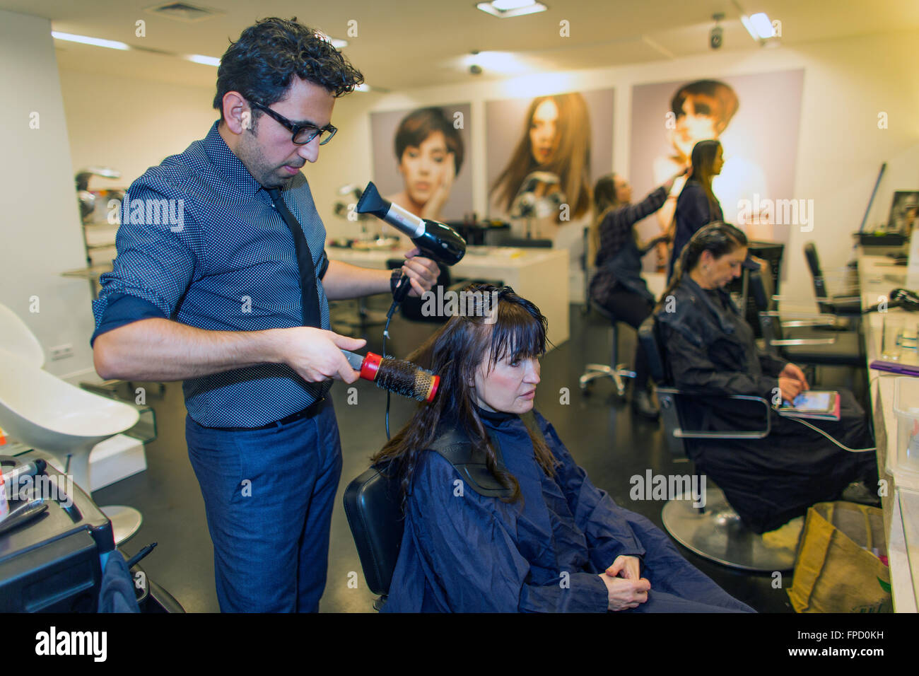 hair dresser at work in Studio B in Amsterdam Stock Photo Alamy