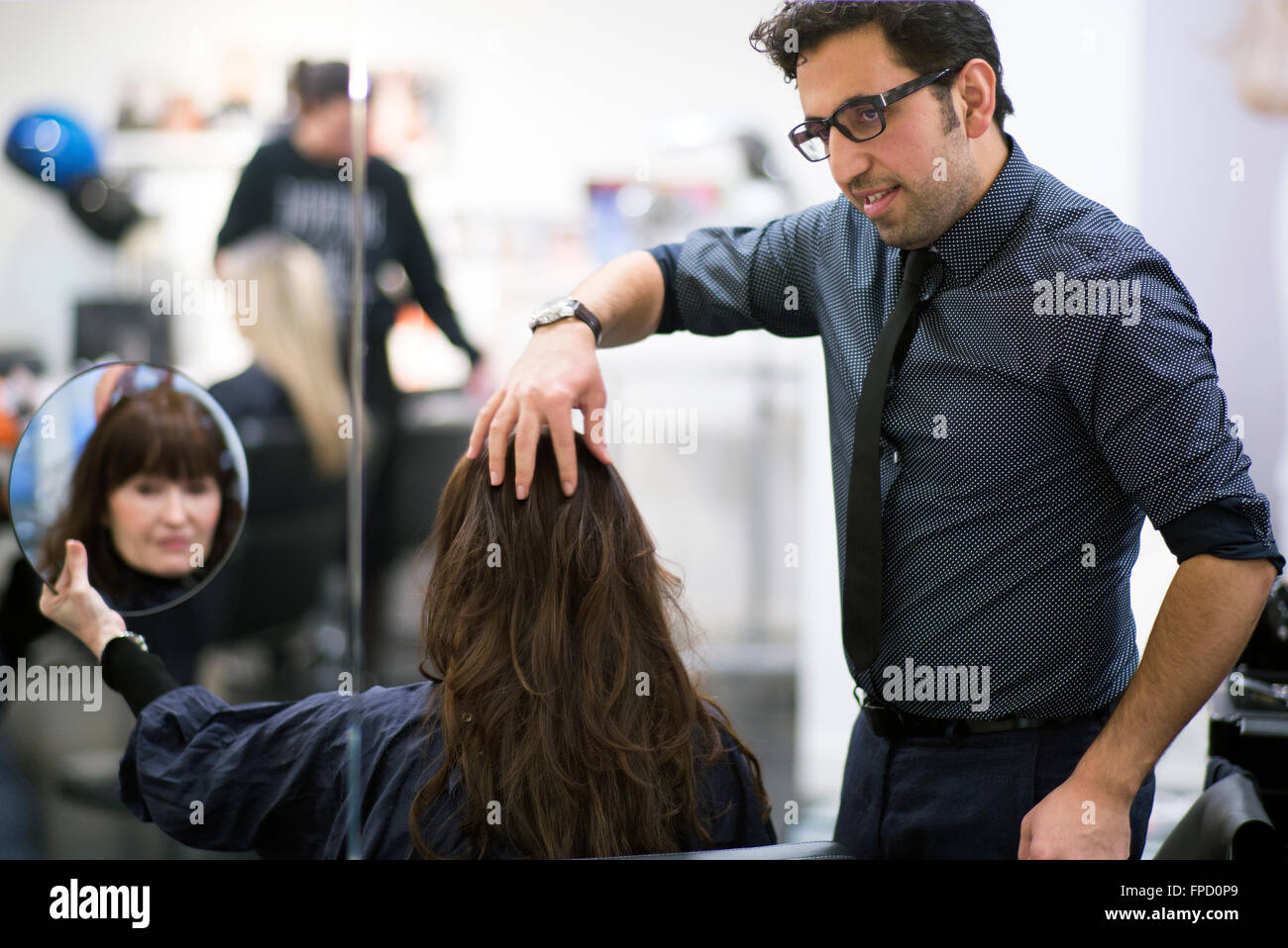hair dresser at work in Studio B in Amsterdam Stock Photo Alamy