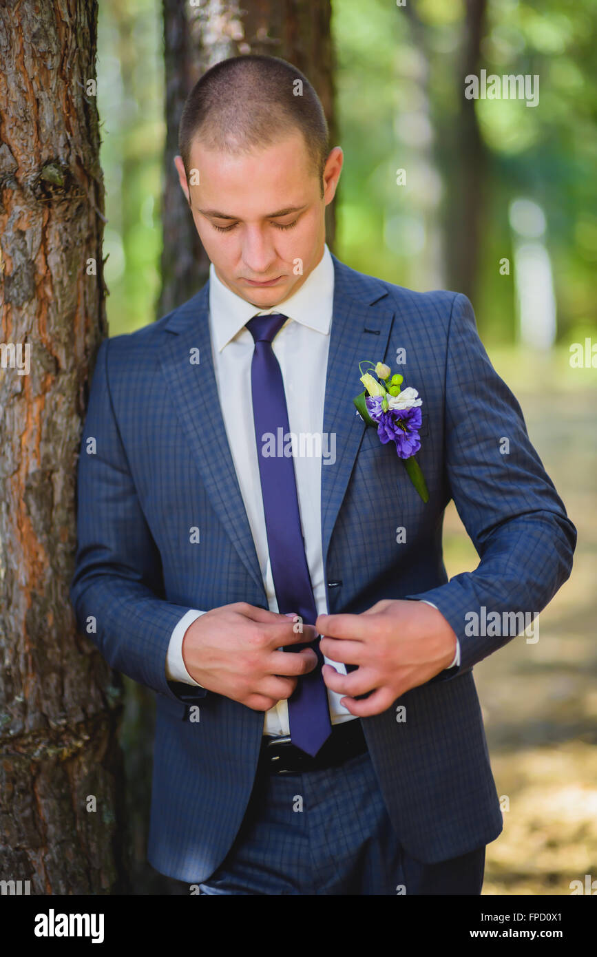 groom jacket fastens Stock Photo