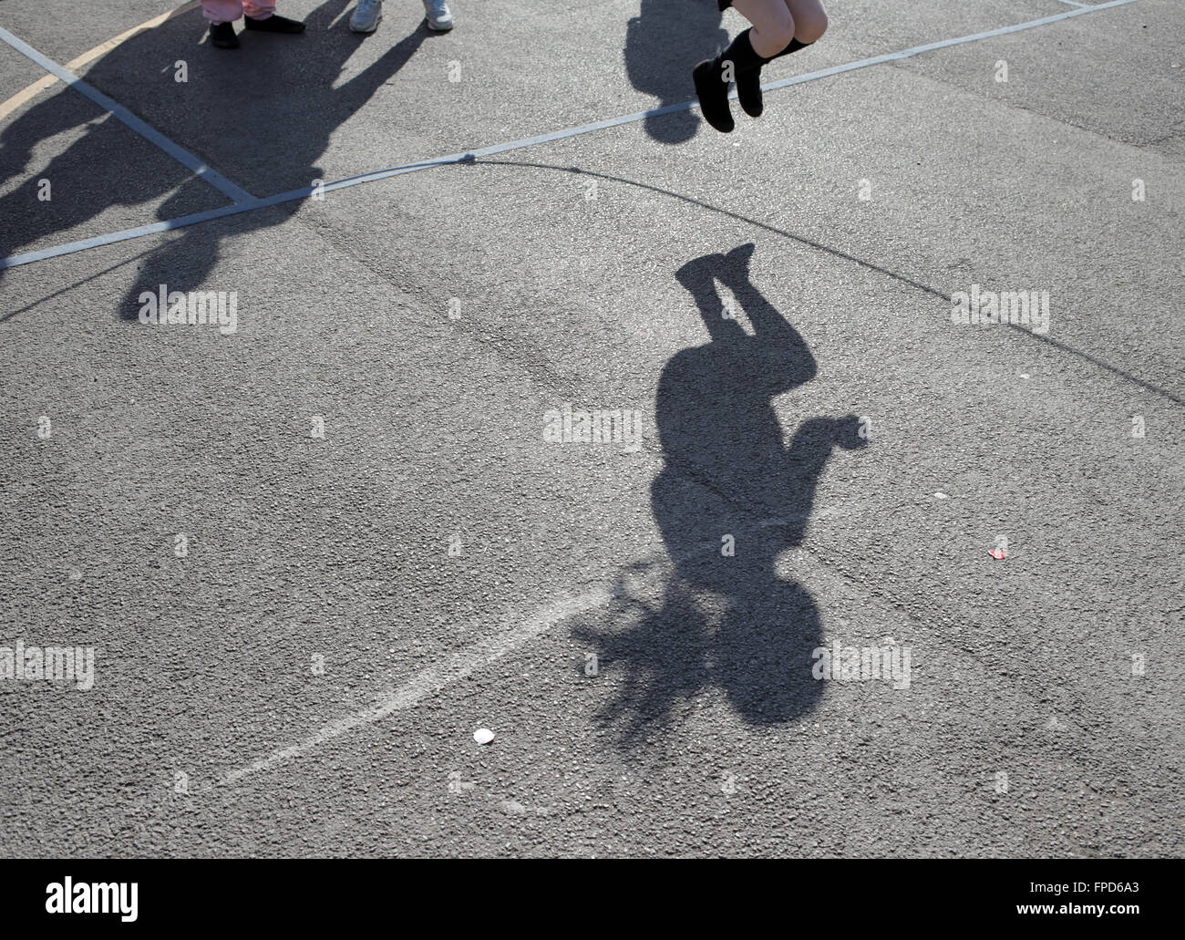 Pupils skipping during playtime at Red Hall Junior School in Darlington, County Durham, UK. Stock Photo