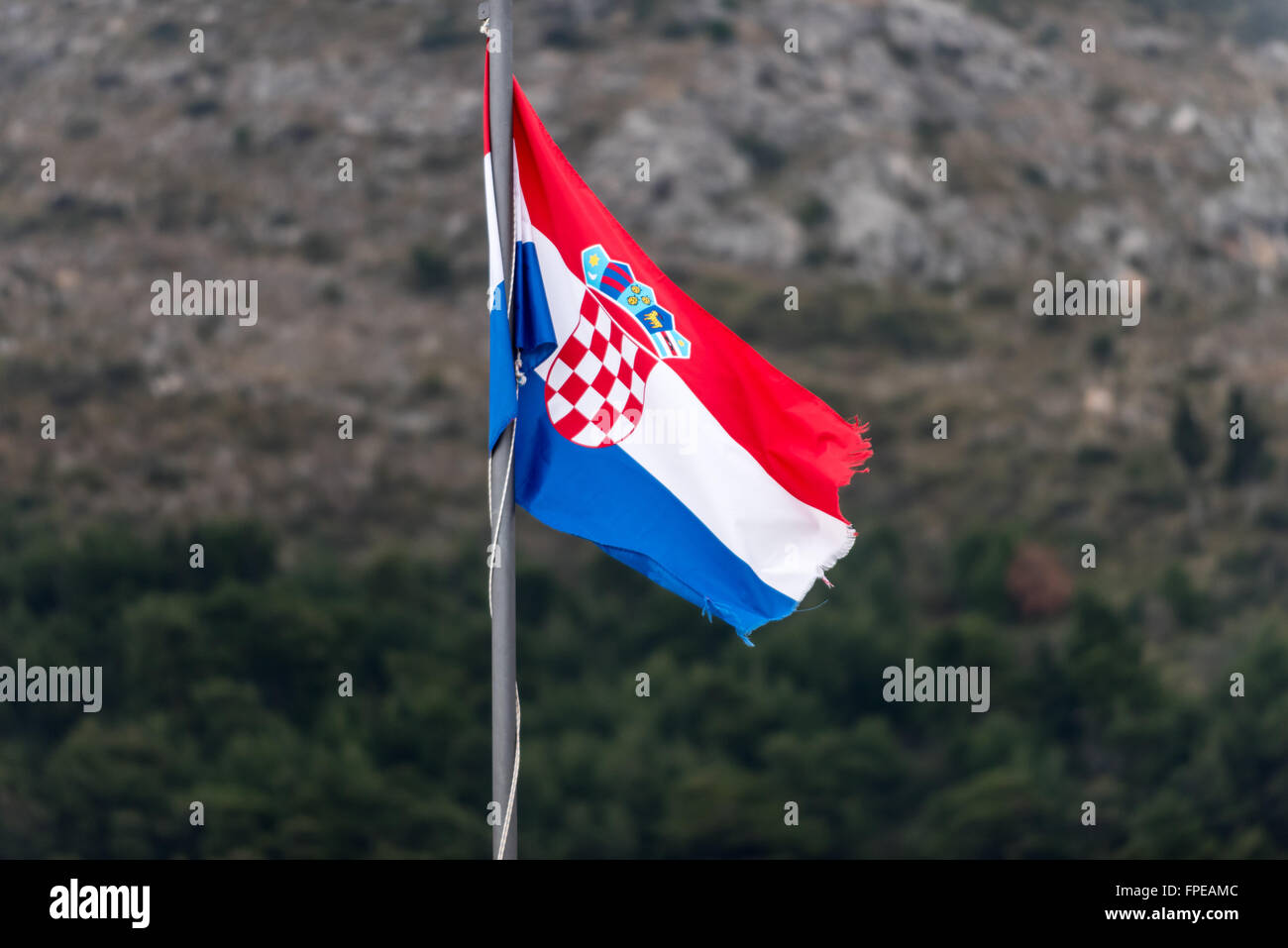 Croatian flag flying over the old city of Dubrovnik. Stock Photo