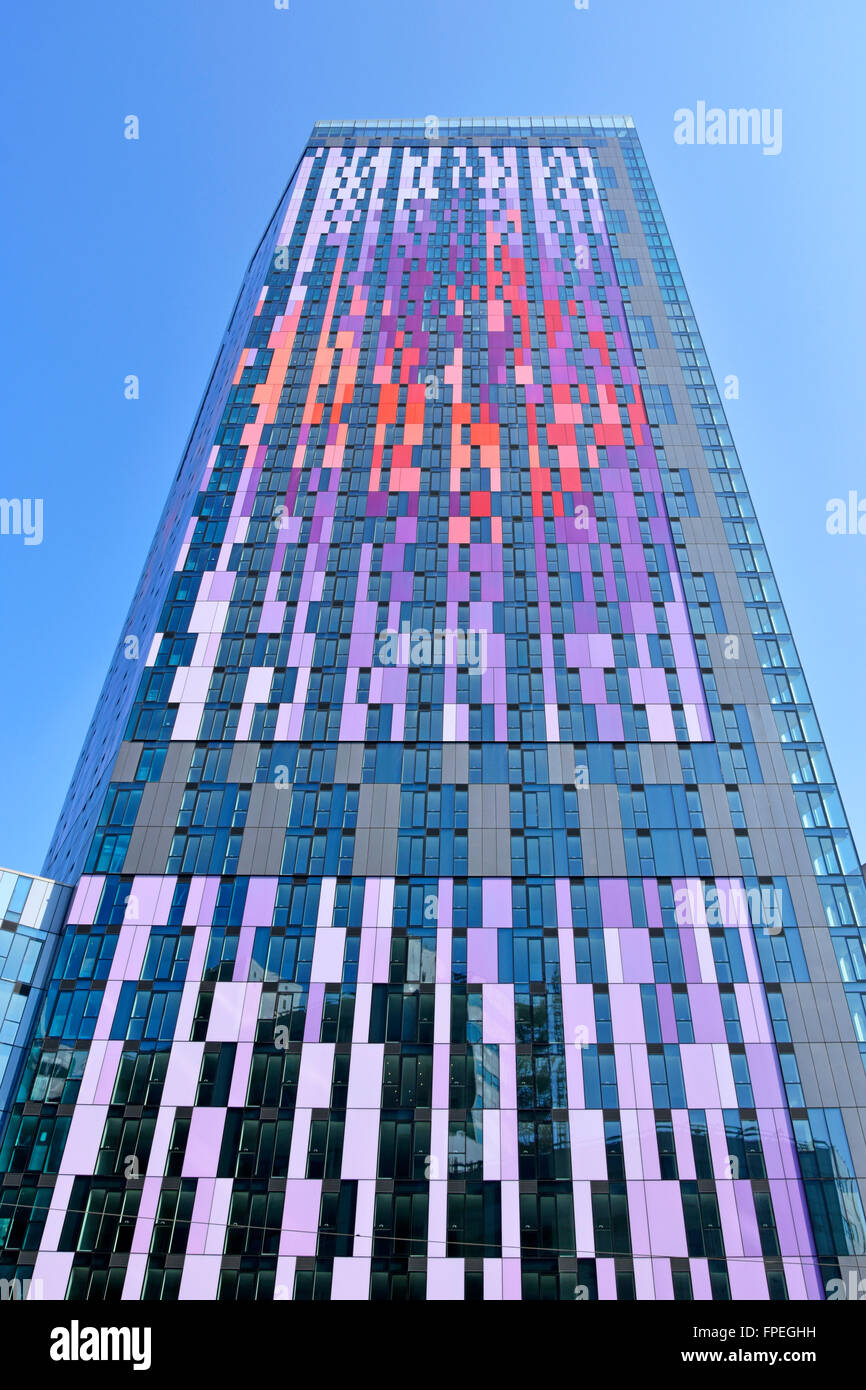 Colourful cladding panels high rise apartment flats by Berkeley Homes landmark skyscraper block against a blue sky Croydon South London England UK Stock Photo
