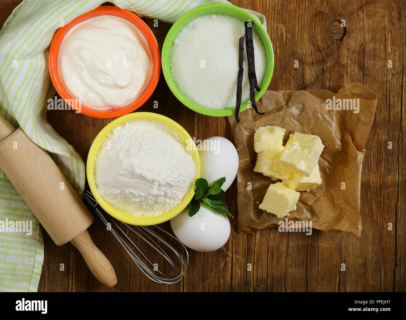 Ingredients for pastry butter, milk, eggs, flour and vanilla sugar on
