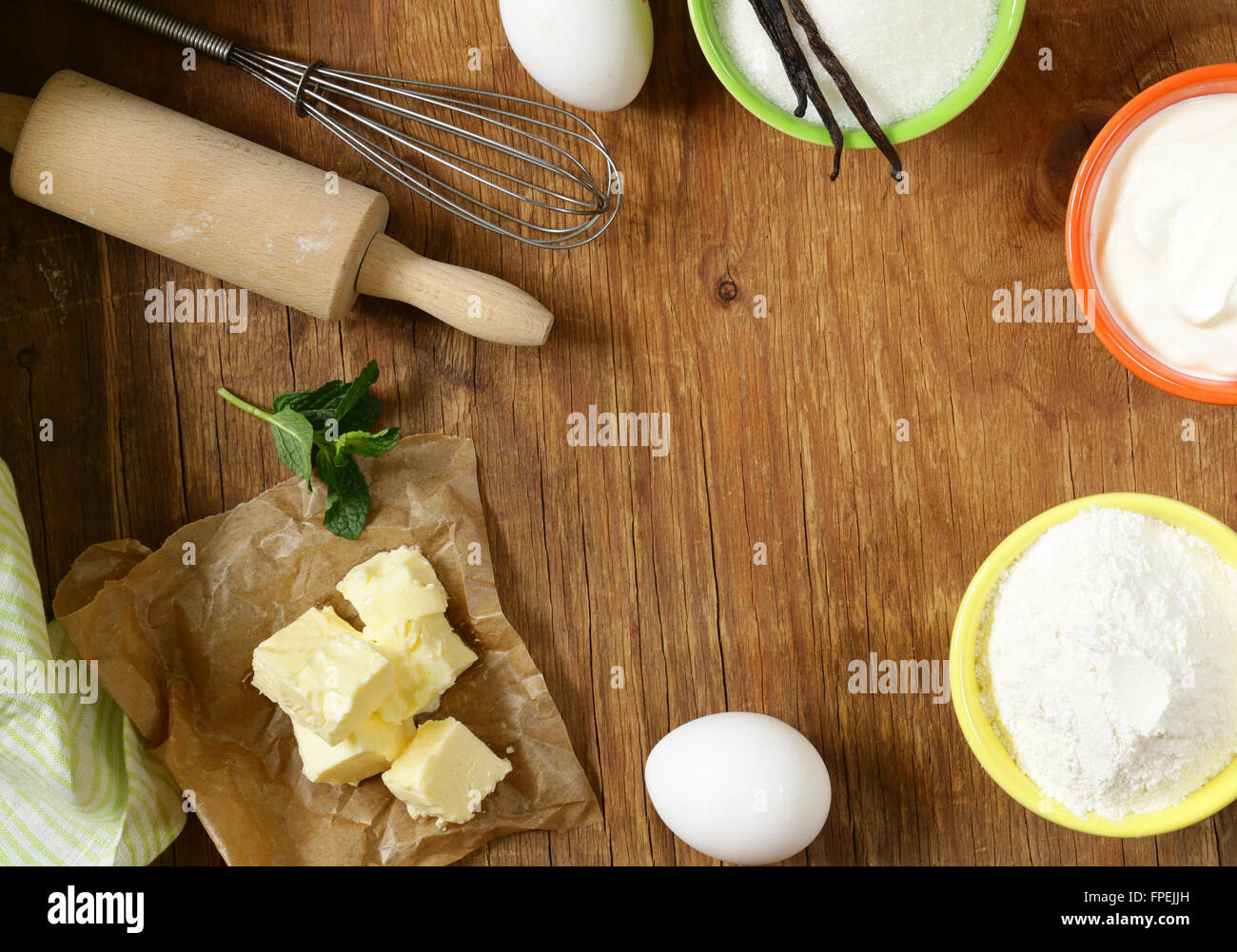 Ingredients for pastry butter, milk, eggs, flour and vanilla sugar on