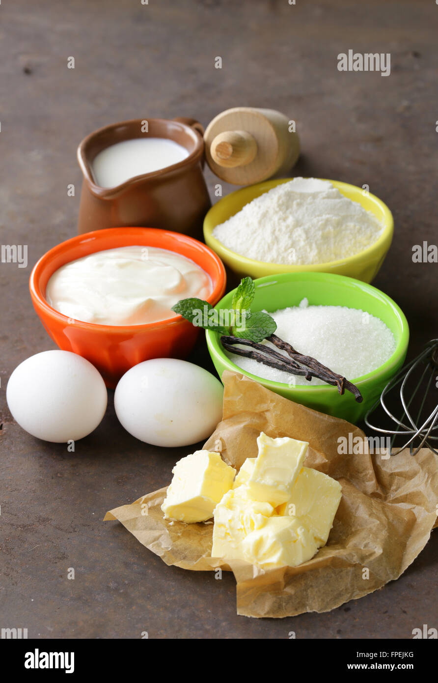 Ingredients for pastry butter, milk, eggs, flour and vanilla sugar on