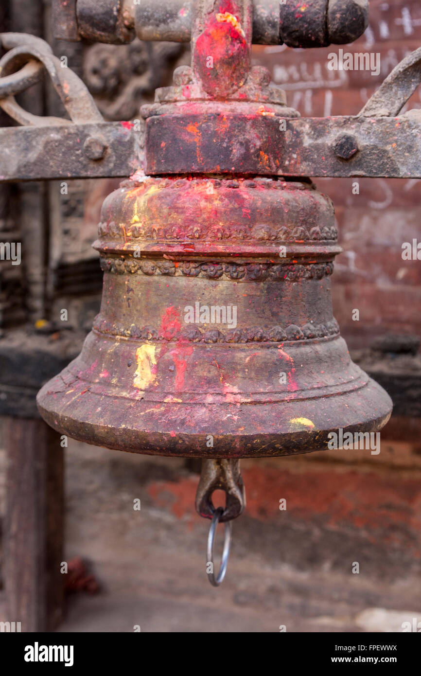 Nepal, Patan.  Temple Bell, with Offering Remnants of Kumkuma (Sindoor) Powder. Stock Photo