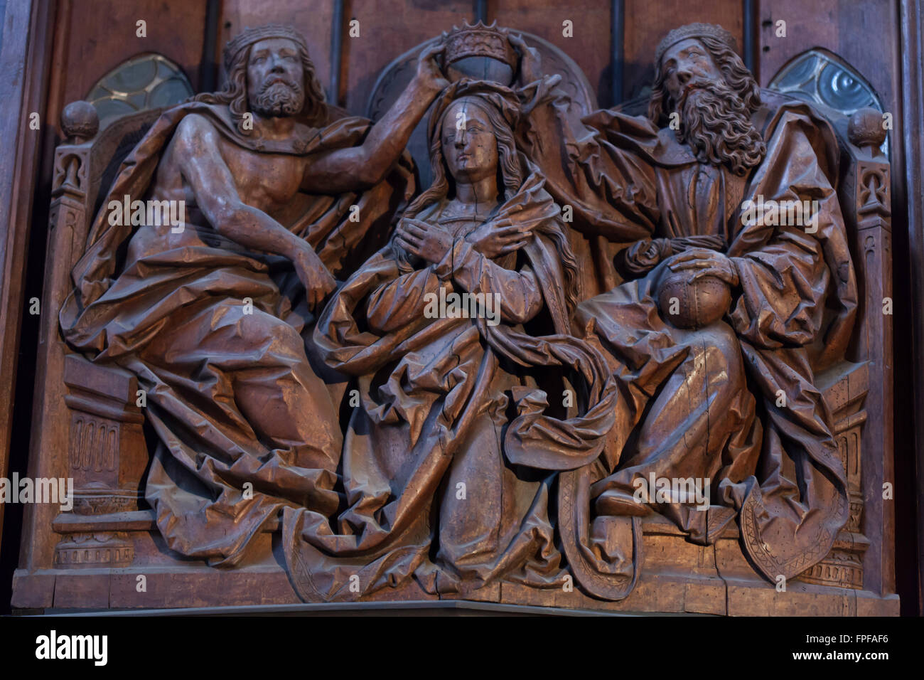 Coronation of the Virgin Mary. Central panel of the Mary Coronation Altarpiece by workshop of German sculptor Tilman Riemenschneider in Saint James' Church in Rothenburg ob der Tauber, Middle Franconia, Bavaria, Germany. Stock Photo