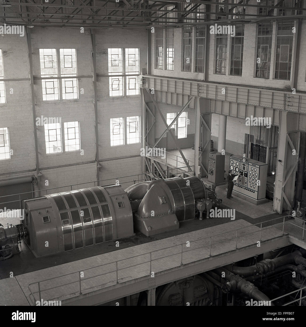 1950s historical, large turbine engine or generator in an electricity power station, Ireland. In this era, many of them were fueled by peat harvested from the numerous peatlands or bogs which cover the West of Ireland. Stock Photo