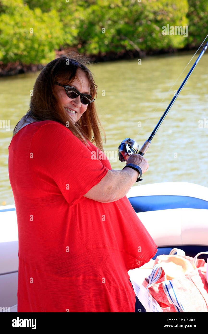 https://c8.alamy.com/comp/FPG0XC/adult-woman-trying-her-hand-at-a-spot-of-fishing-in-florida-FPG0XC.jpg