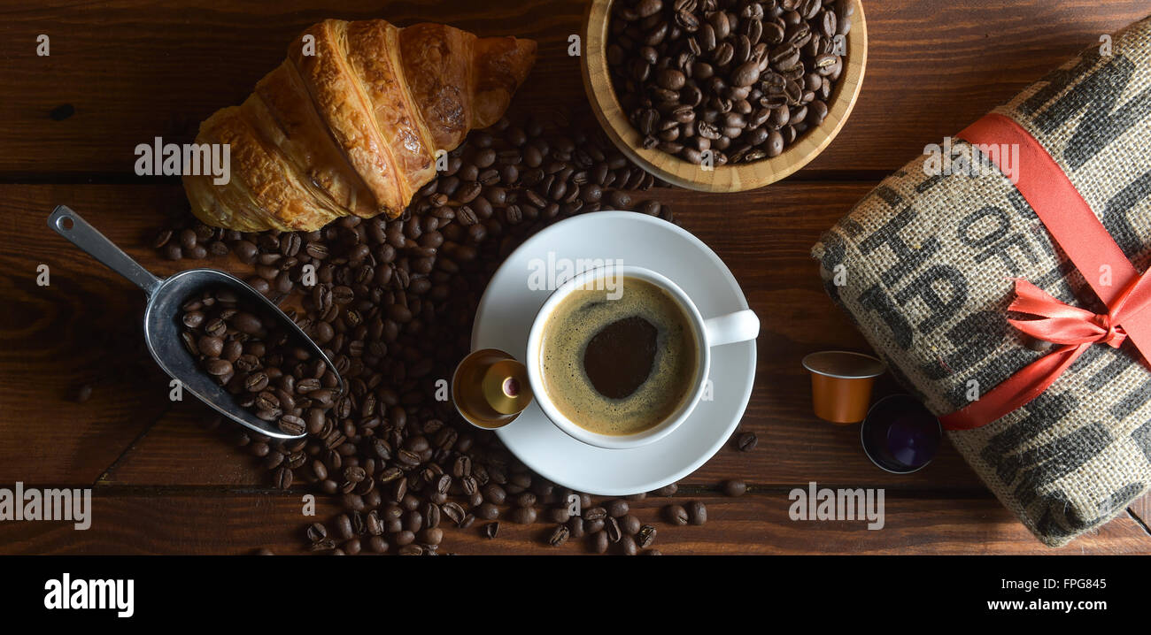 Shot Of Coffee And Croissant On Table Stock Photo