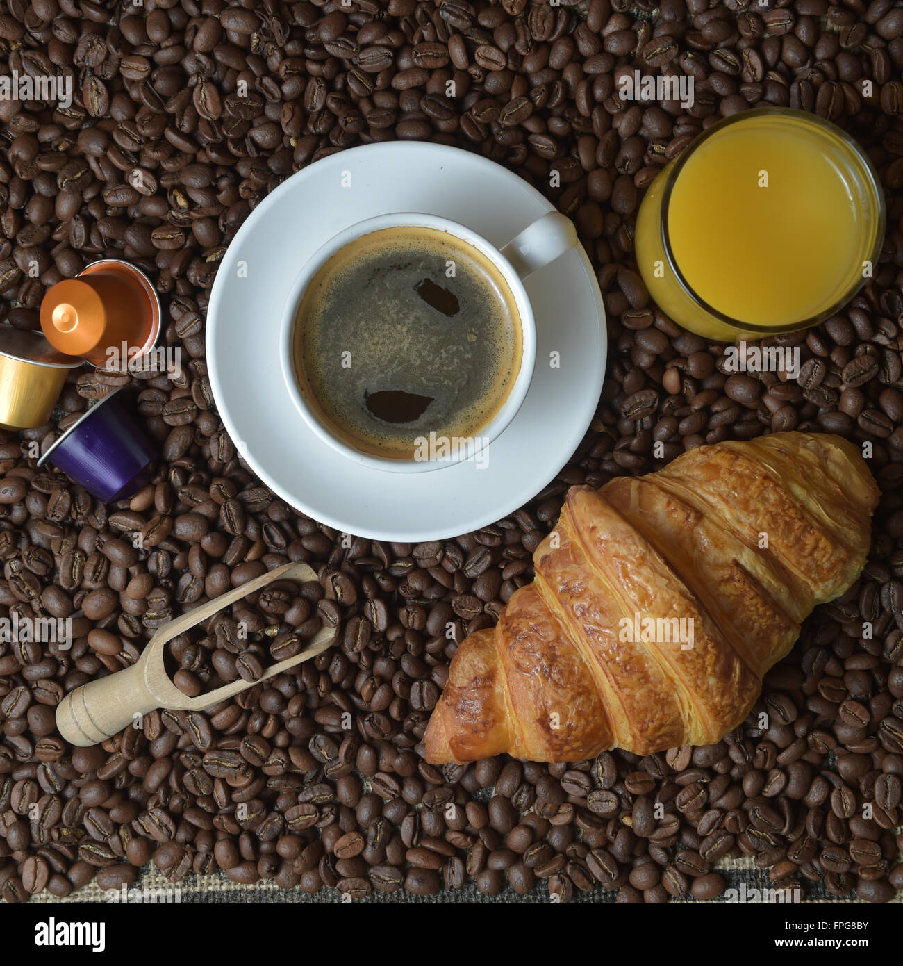 Shot Of Coffee And Croissant On Table Stock Photo