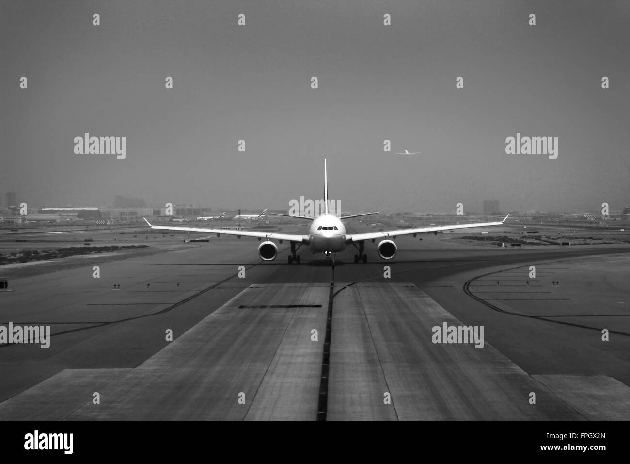 aircraft taking off on airstrip Stock Photo