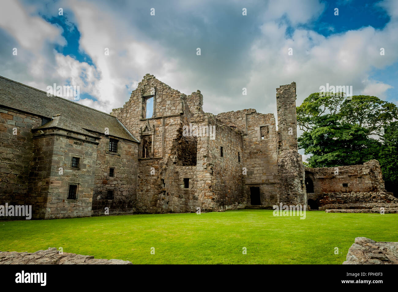 Ruins of Aberdour Castle in Fife, Scotland with Blue and Stormy Skies