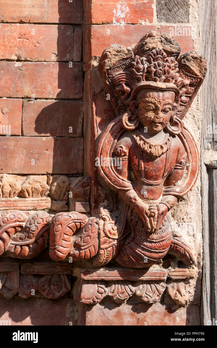 Nepal, Patan.  Decorative Stone Carving on House Wall. Stock Photo