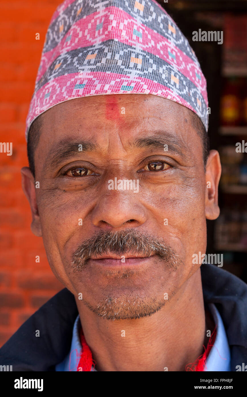 Nepal, Patan.  Nepalese Man Wearing a Nepali Hat (Dhaka Topi). Stock Photo