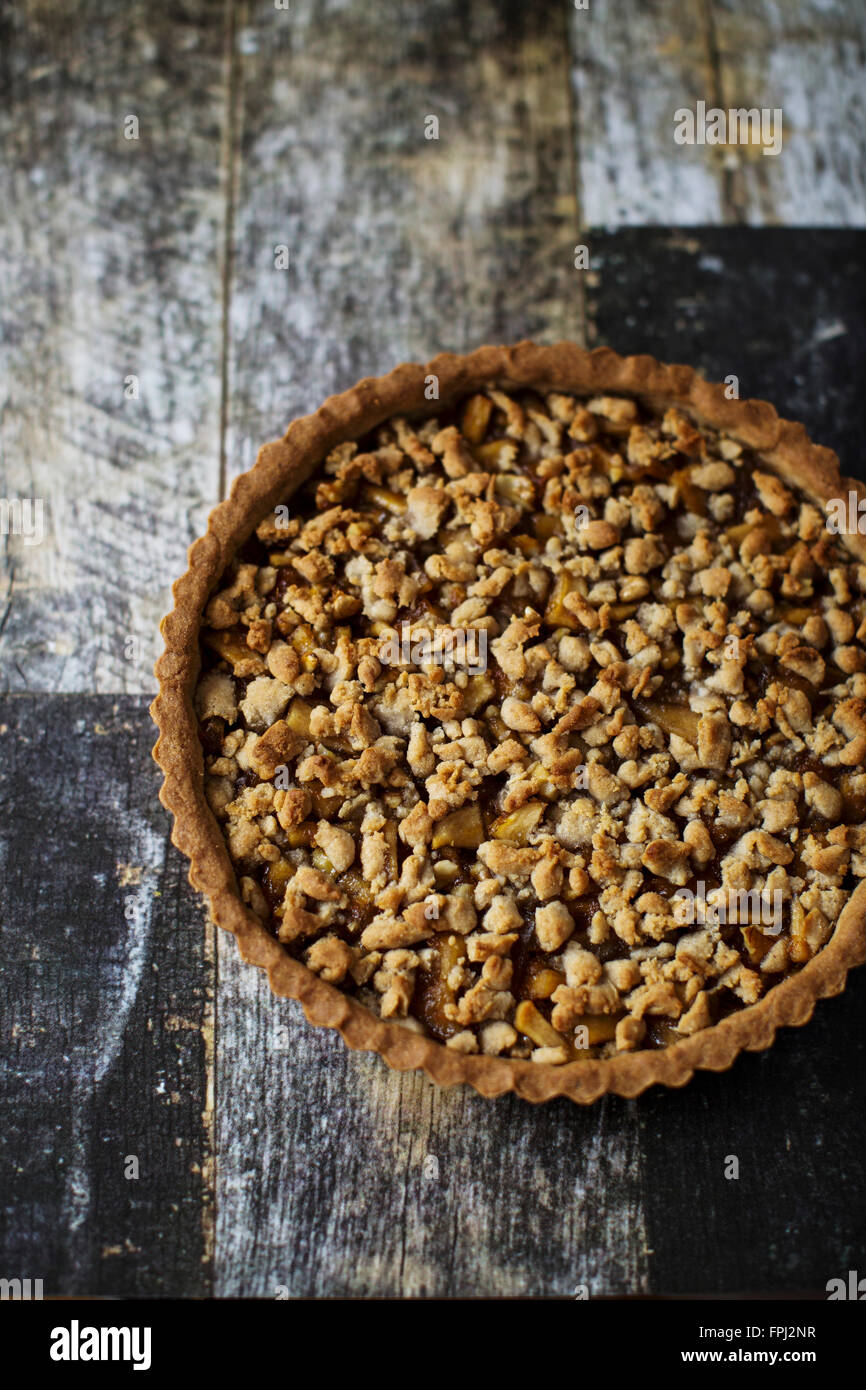 Gluten free tart with chestnut eggless crust, filled with marmelade, candied apples and walnuts Stock Photo