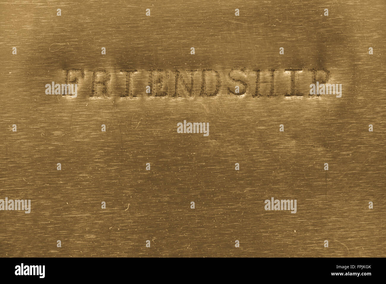 word friendship printed on golden metallic background Stock Photo