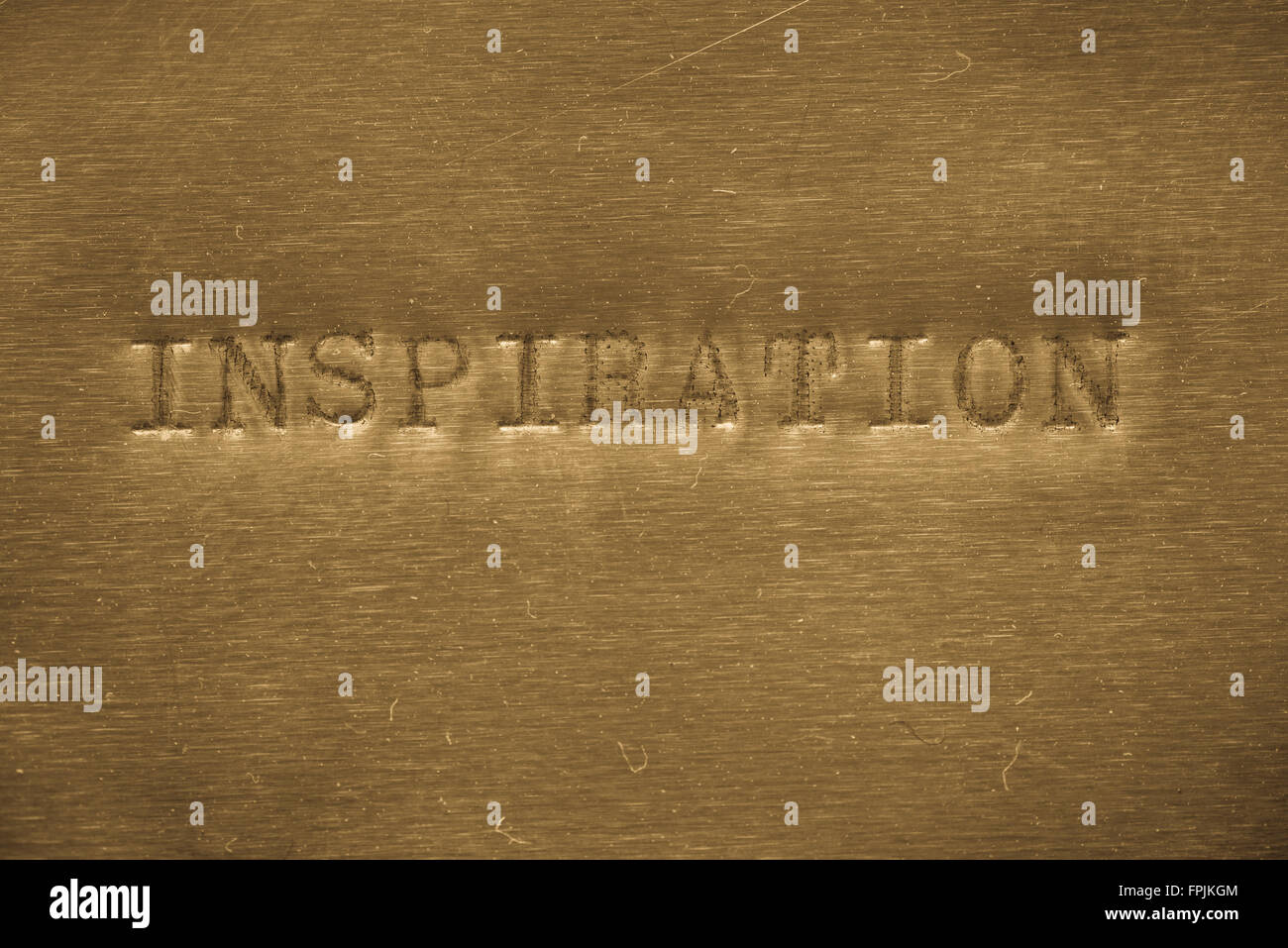 word inspiration  printed on golden metallic background Stock Photo