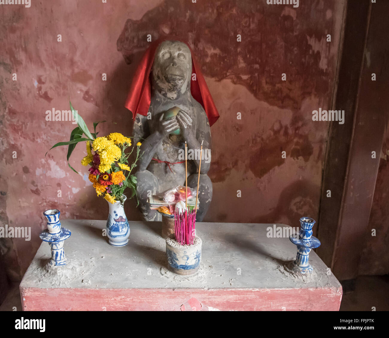 Hoi An, Vietnam Shrine to the sacred  Monkey at one end of the Japanese Covered Bridge,the year the bridge was finished Stock Photo
