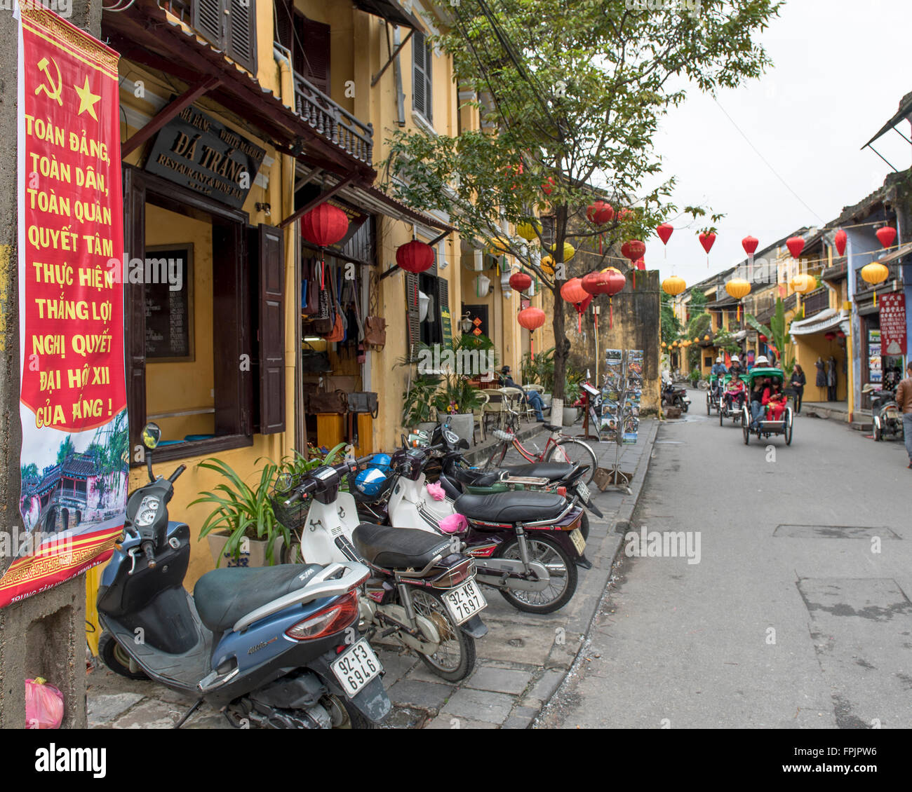 Hoi An,Vietnam, Street scene with lanterns, Vietnamese and communist posters celebrating the Communist Summit Stock Photo