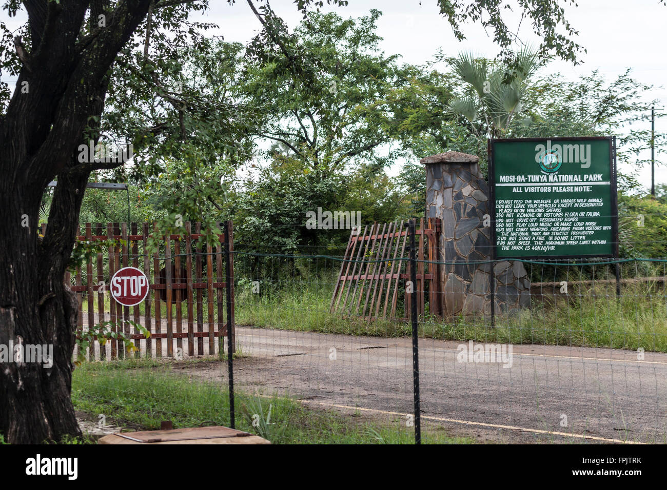 Entrance with sign at Mosi-oa-Tunya National Park, adjacent to the Victoria Falls in Livingstone, Zambia, Africa Stock Photo