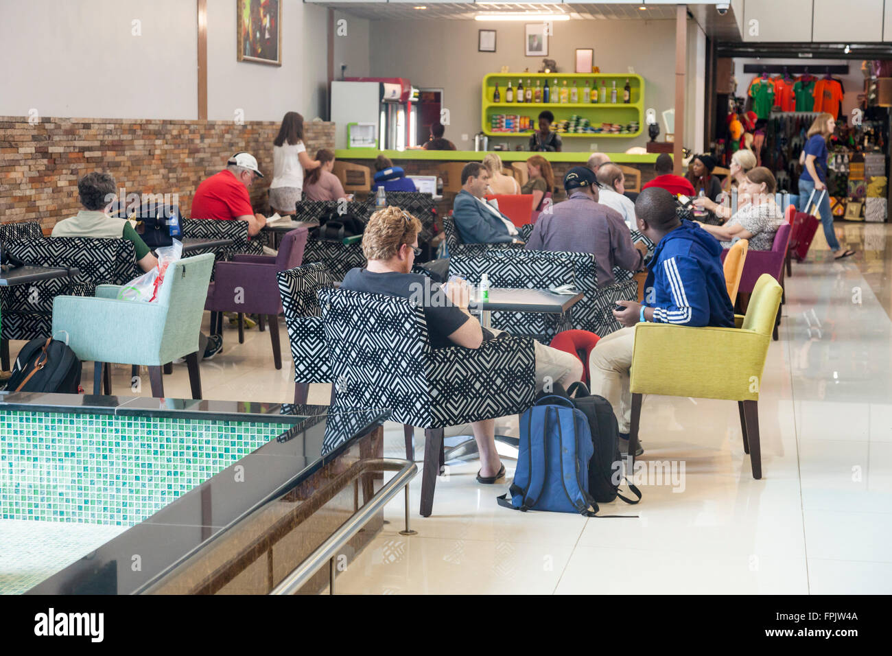 Waiting air passengers in the cafe in Harry Mwanga Nkumbula International Airport, Livingstone, Zambia, Africa Stock Photo