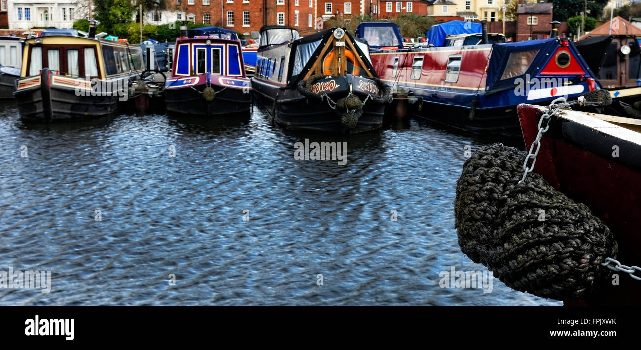 A winter respite for moored barges and canal boats at rest at Stourport upon Severn canal basin and port harbour Stock Photo