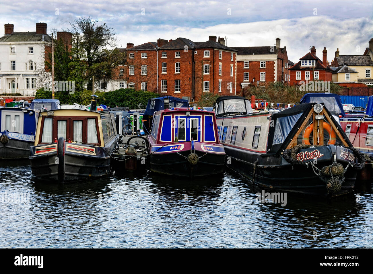 A winter respite for moored barges and canal boats at rest at Stourport upon Severn canal basin and port harbour Stock Photo