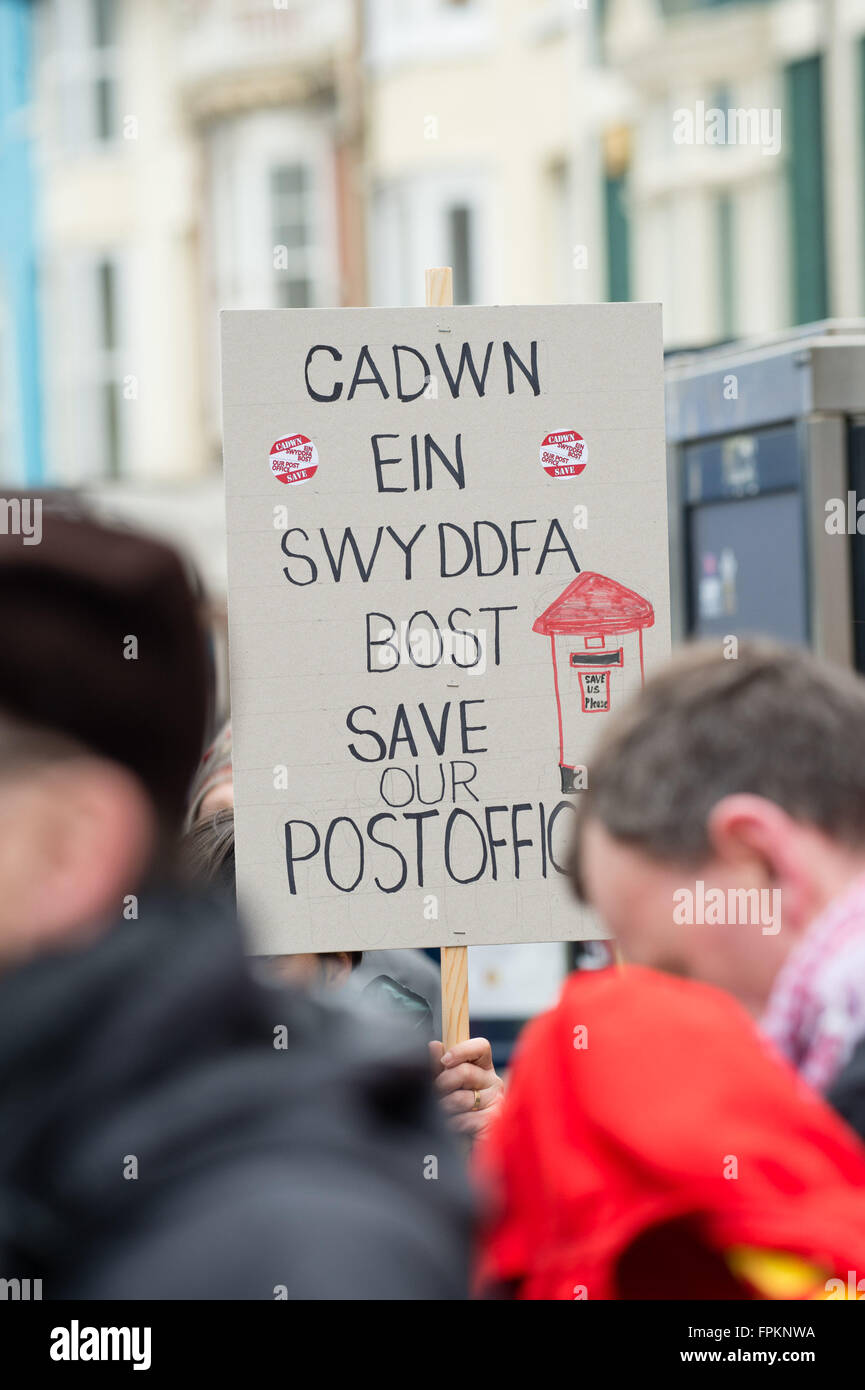 Aberystwyth, Wales, UK. 19th March, 2016. People holding banners and placards at a public protest in the centre of Aberystwyth to protest at the planned closure of the town's only post office and to move the services it provides to a ‘franchise' in a shop or store photo Credit:  keith morris/Alamy Live News Stock Photo