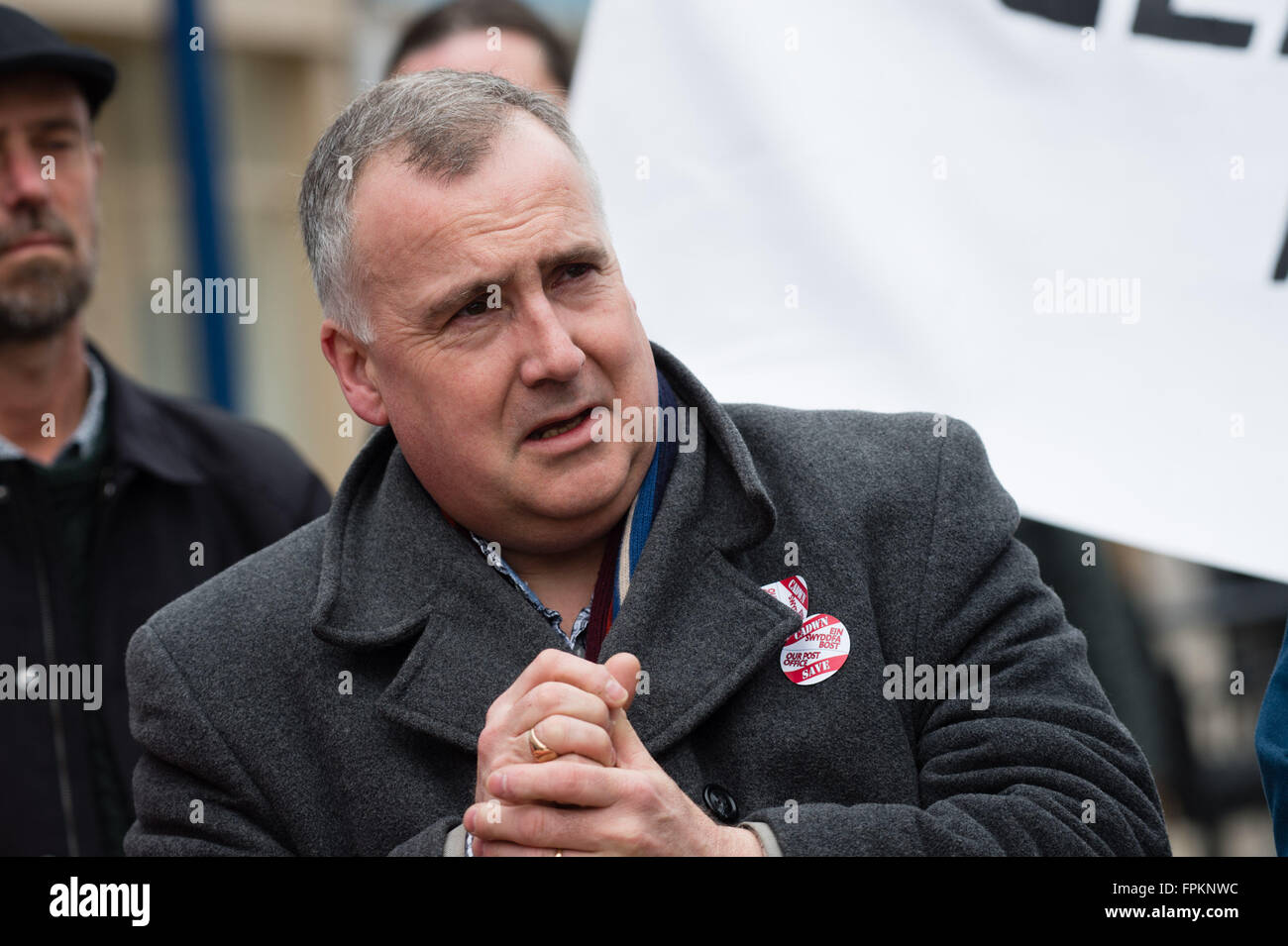 Aberystwyth, Wales, UK. 19th March, 2016. MARK WILLIAMS, Lib Dem MP for the Ceredigion constituency, at a public protest in the centre of Aberystwyth to protest at the planned closure of the town's only post office and to move the services it provides to a ‘franchise' in a shop or store photo Credit:  keith morris/Alamy Live News Stock Photo
