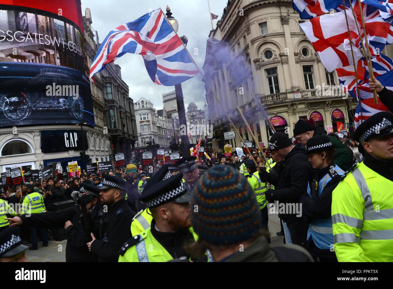 London, UK. March 19th 2016. Smoke bomb thrown from the prorefugee