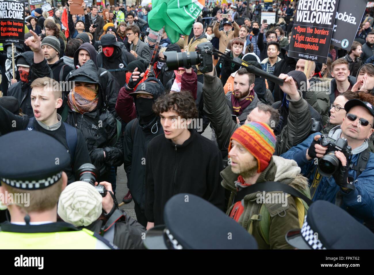 London, UK. March 19th 2016. Tension as police stop protesters from reaching one another. Credit:  Marc Ward/Alamy Live News Stock Photo
