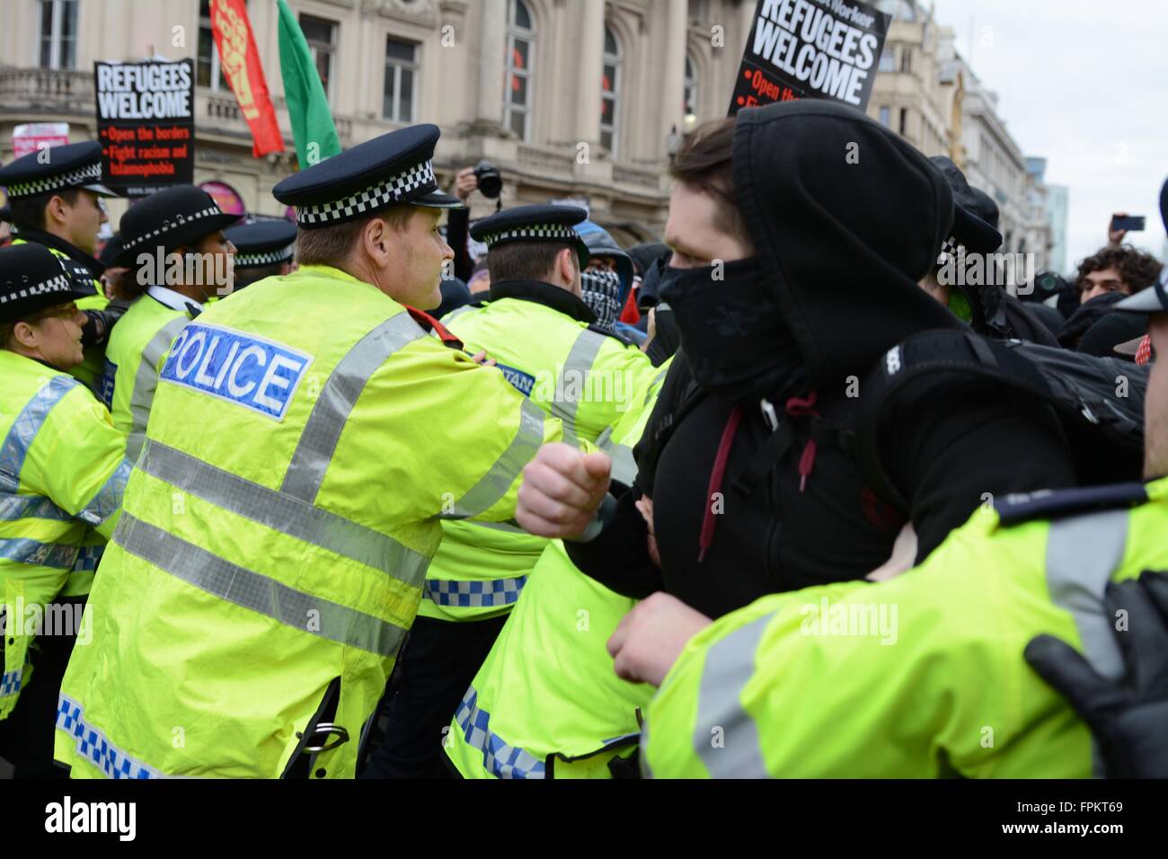 London, UK. March 19th 2016. Protester attempting to break police lines in Piccadilly Circus Credit:  Marc Ward/Alamy Live News Stock Photo