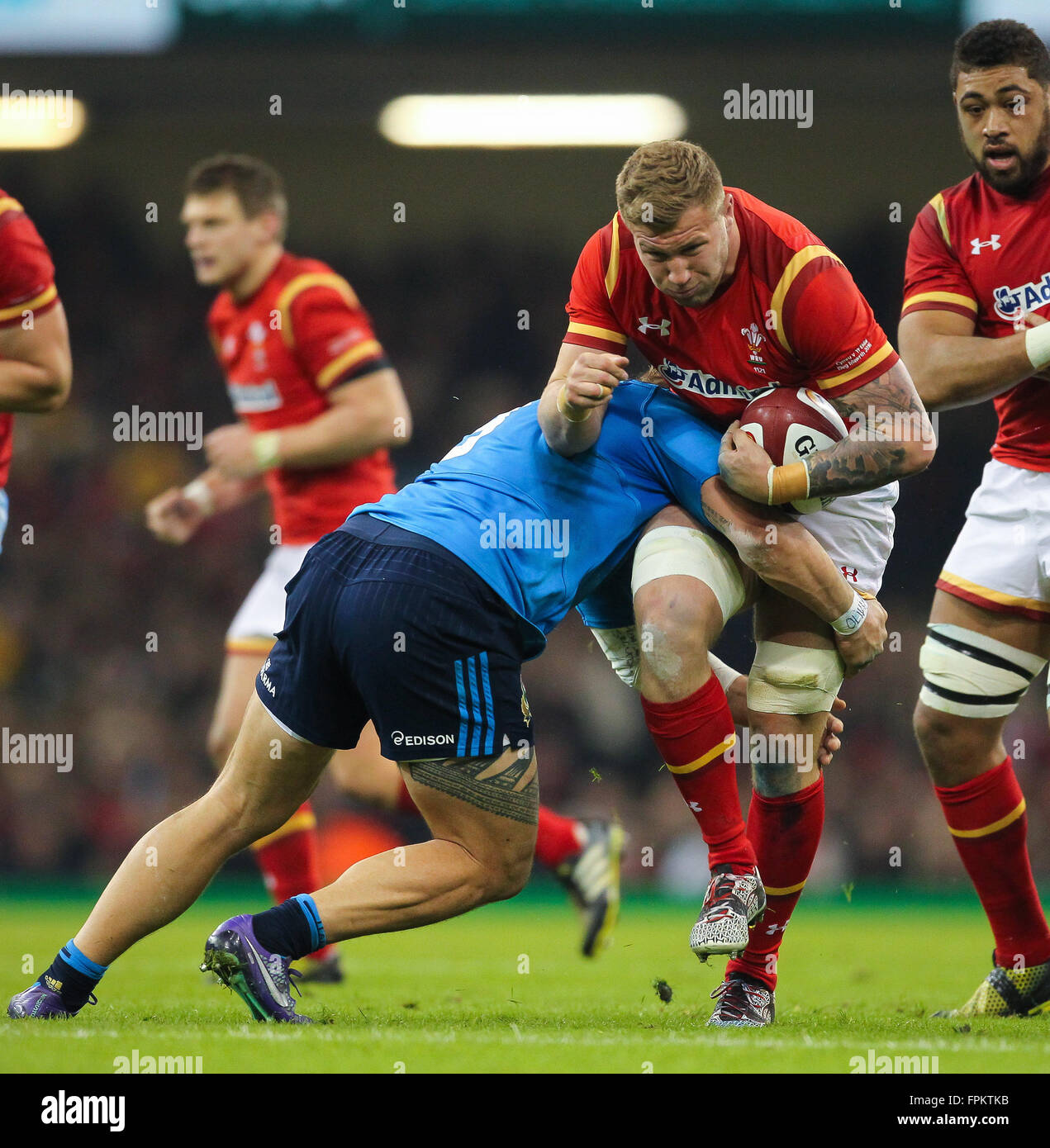 Principality Stadium, Cardiff, Wales. 19th Mar, 2016. RBS Six Nations Championships. Wales versus Italy. Wales Ross Moriarty gets tackled by Italy's Martin Castrogiovanni Credit:  Action Plus Sports/Alamy Live News Stock Photo