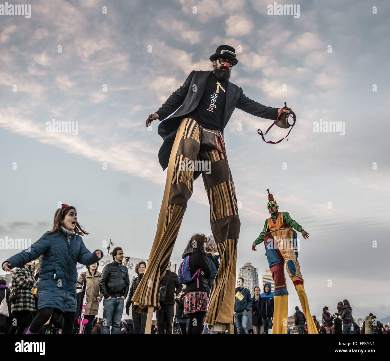 Barcelona, Catalonia, Spain. 19th Mar, 2016. Stilt walkers take part in an anti-racism and pro-refugee protest at the beach of Barcelona. © Matthias Oesterle/ZUMA Wire/Alamy Live News Stock Photo