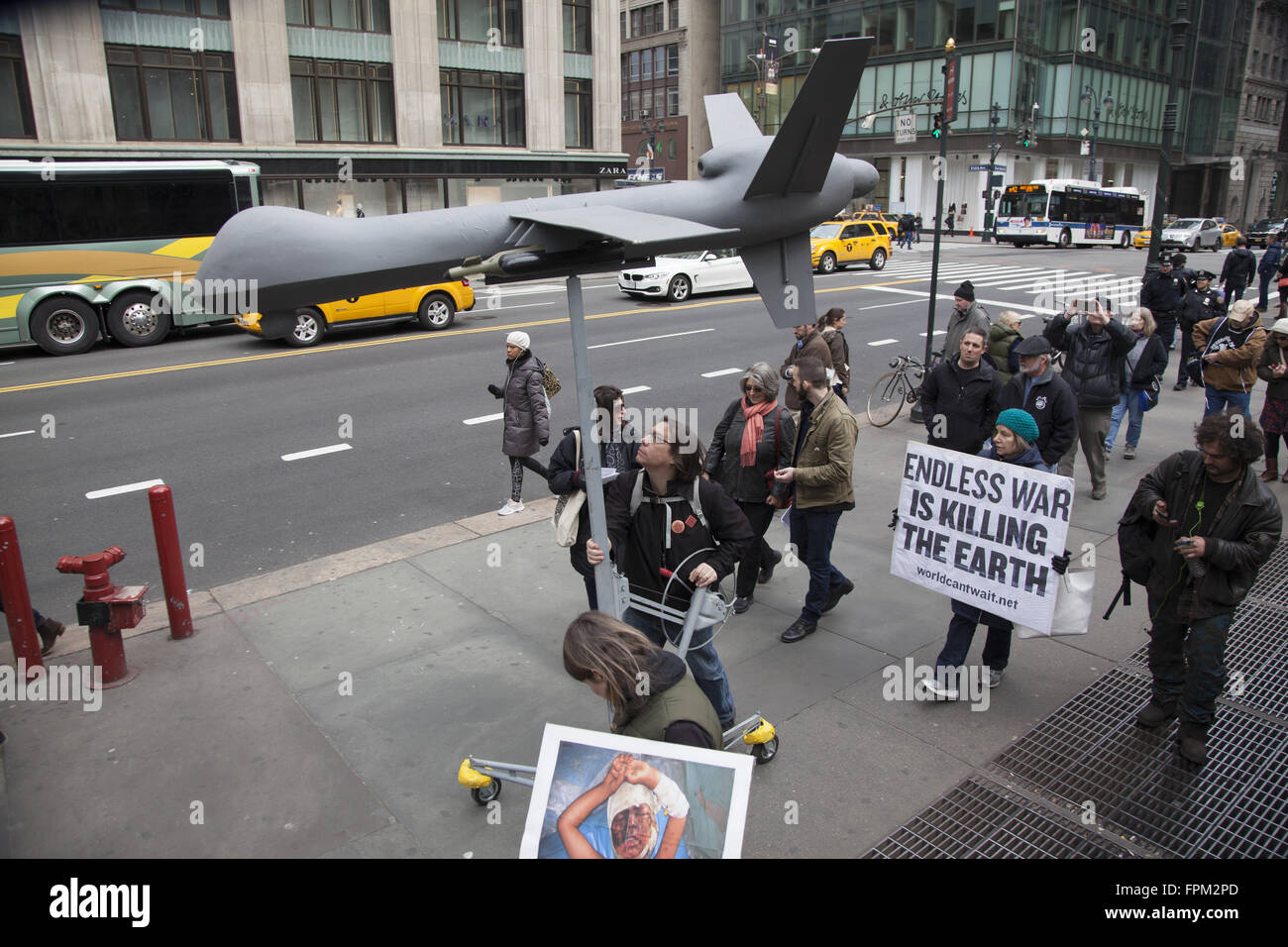 New York, USA. 19th Mar, 2016. Coalition of activist groups march and have a silent vigil bringing attention to the out of control destructiveness of U.S. militarism accomplishing nothing positive and displacing whole societies as in Iraq & Syria. Credit:  David Grossman/Alamy Live News Stock Photo