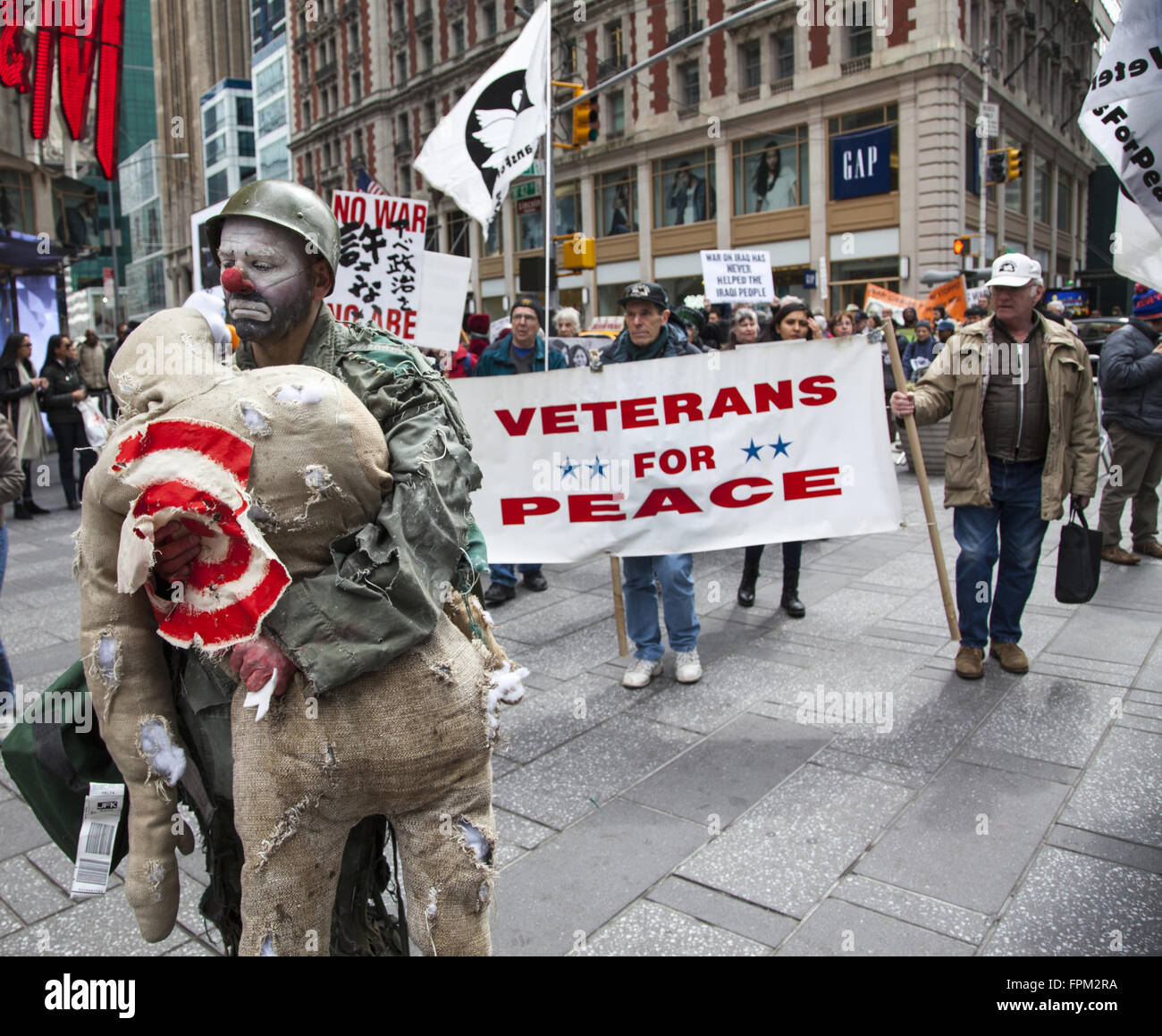 New York, USA. 19th Mar, 2016. Coalition of activist groups march and have a silent vigil bringing attention to the out of control destructiveness of U.S. militarism accomplishing nothing positive and displacing whole societies as in Iraq & Syria. Credit:  David Grossman/Alamy Live News Stock Photo