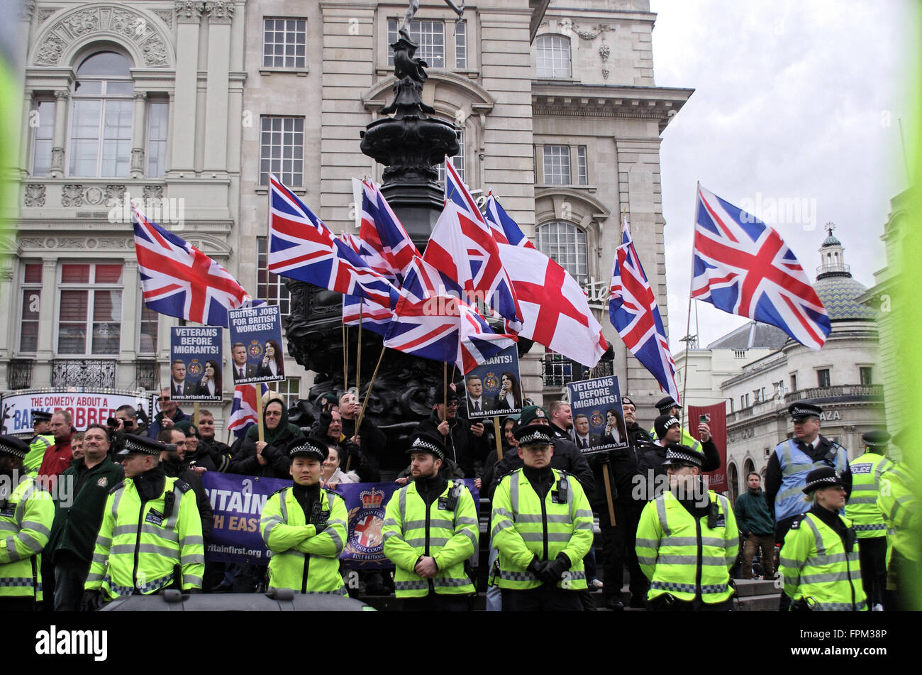 London, UK. Saturday 19th March 2016. The Britain first demonstrators are kept apart from antifascist demonstrators by a police dordon. Stock Photo