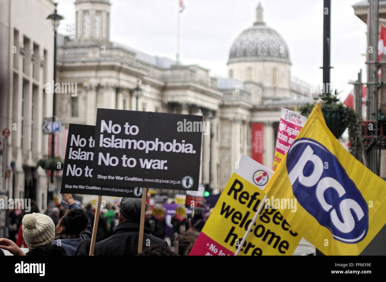 London, UK. Saturday 19th March 2016. Thousands march down Regent Street to Trafalgar Square in a Refugees Welcome march, carrying banners and placards with anti-rascist slogans supporting refugees. Stock Photo