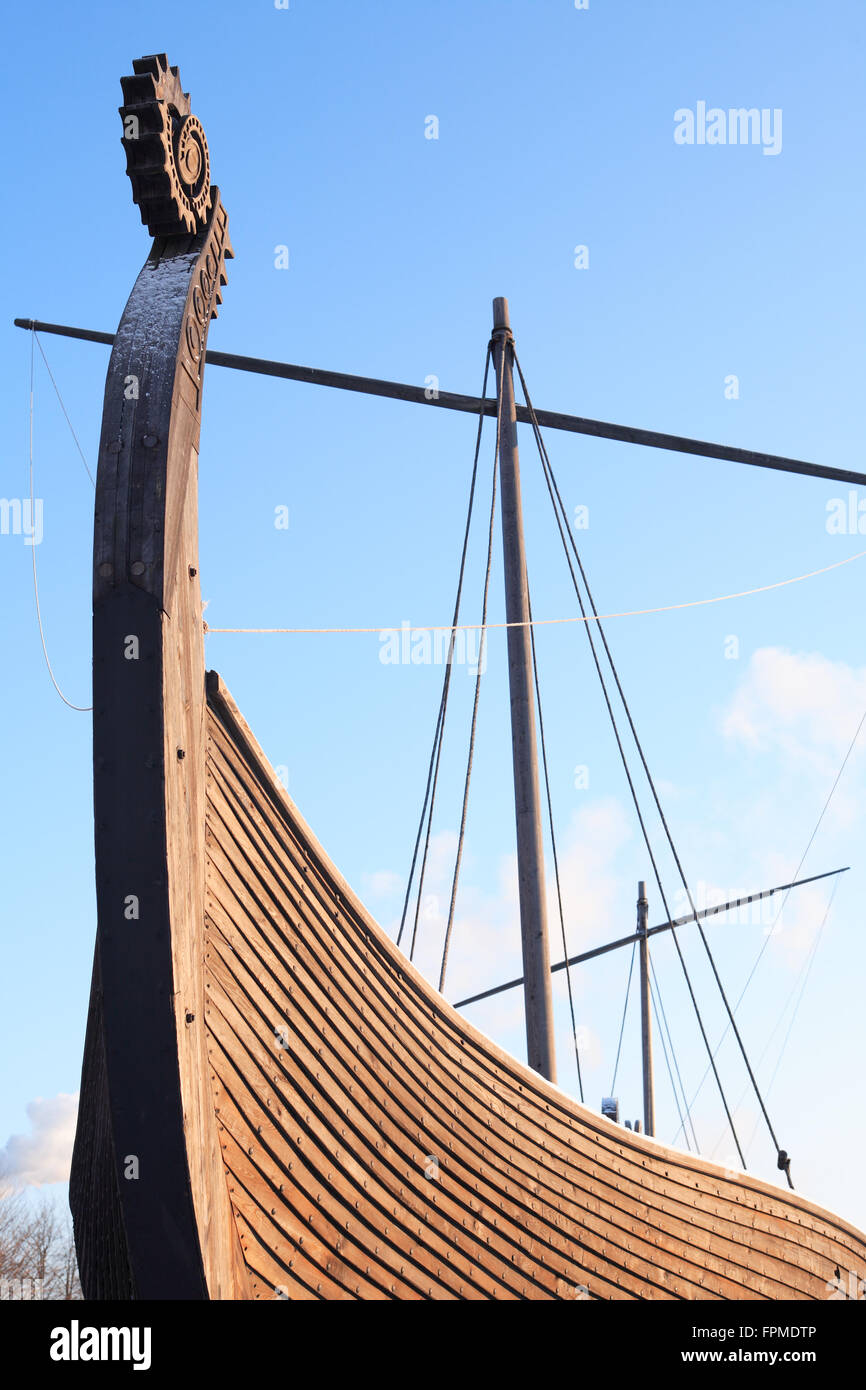 Fragment of ancient Viking ship named Drakkar against blue sky Stock Photo