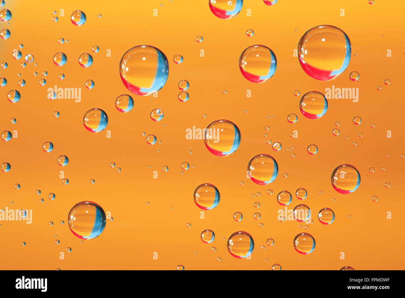 Abstract yellow background with various colorful water drops Stock ...