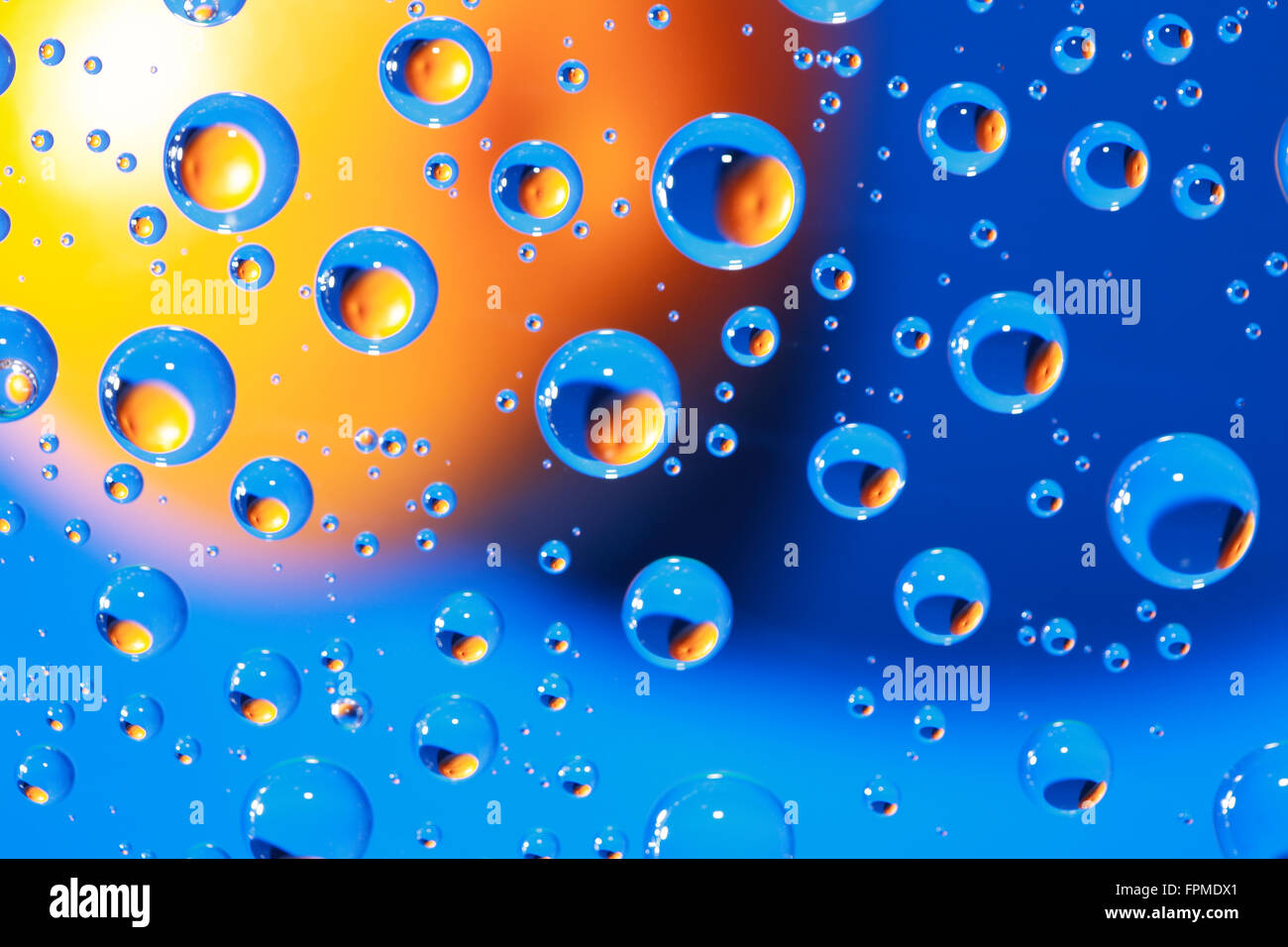 Abstract blue background with various water drops and orange Stock ...