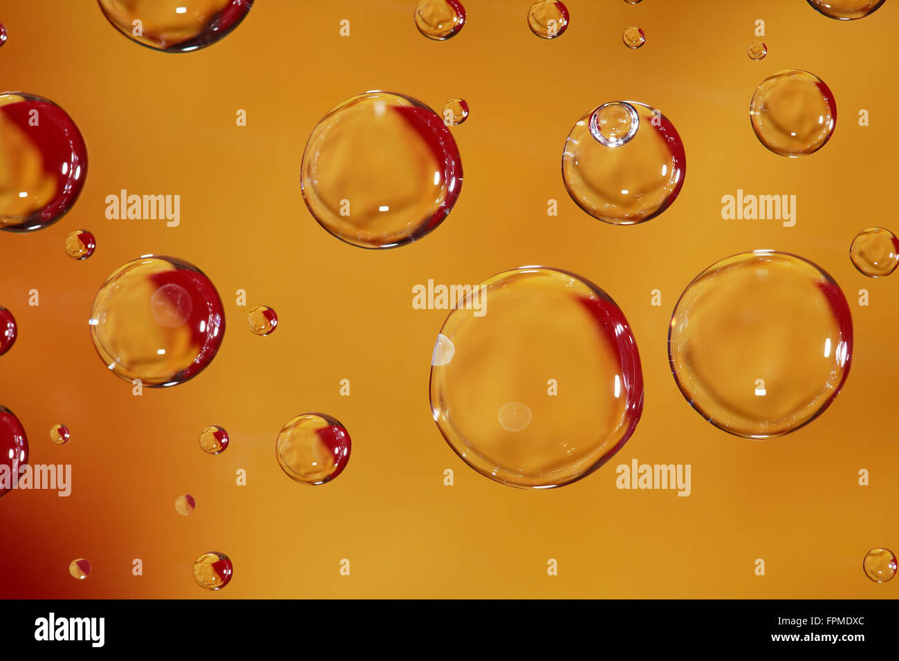 Abstract yellow background with various water drops Stock Photo - Alamy