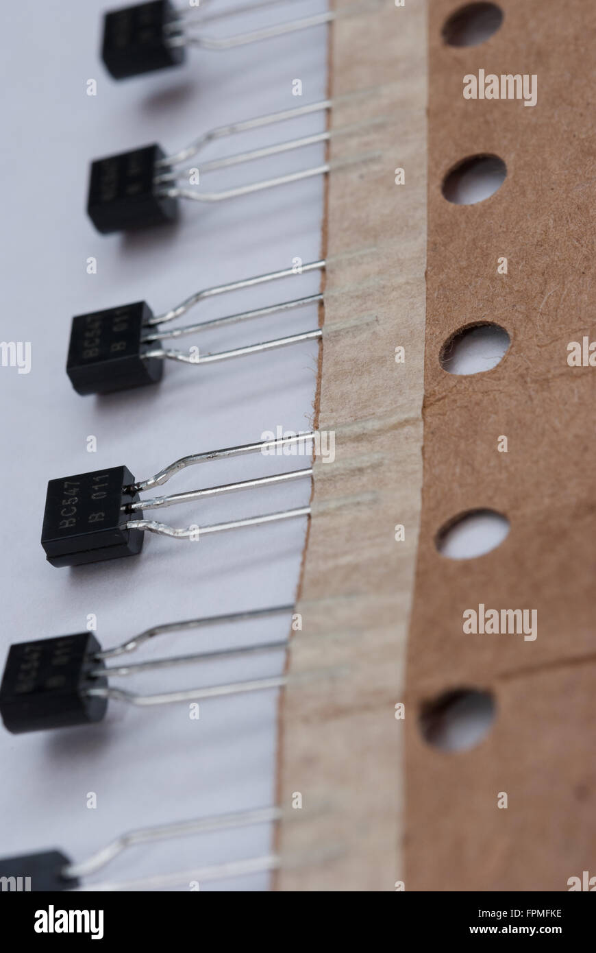 Package of BC547 NPN Transistors on a white background closeup Stock