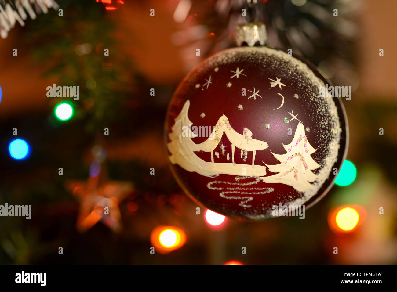 Globe with Christmas decorations hanging in tree Stock Photo Alamy