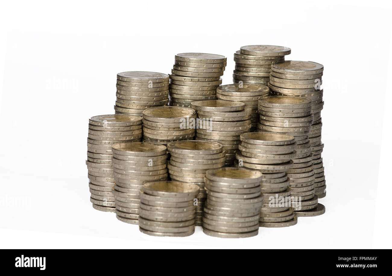 piles of coins on white background Stock Photo - Alamy
