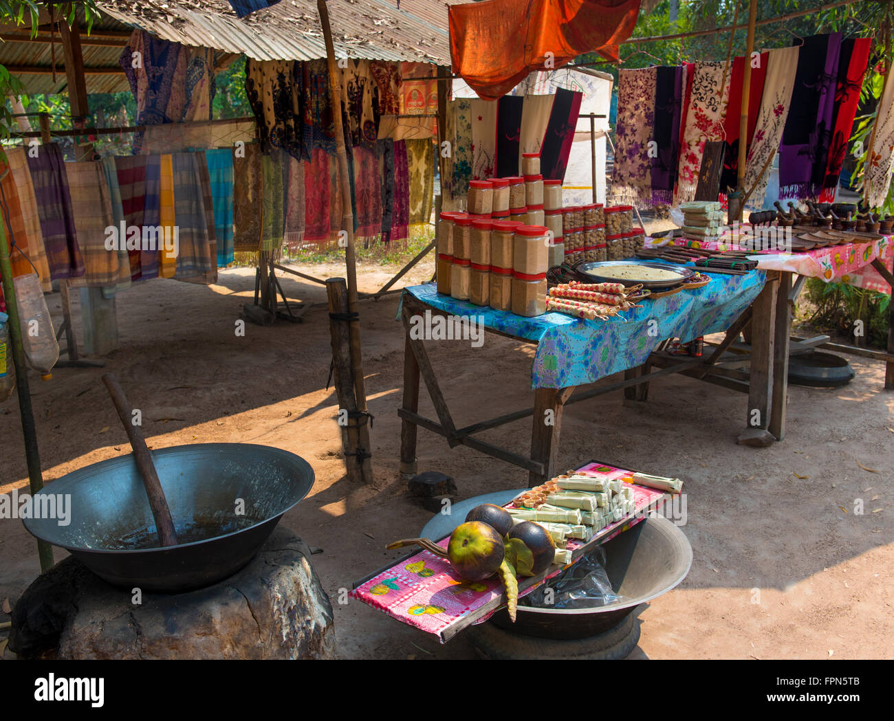 The Palmyra, or sugar, Palm, Borassus flabellifer is commonly grown in Cambodia. Roadside stalls make and sell sweets Stock Photo