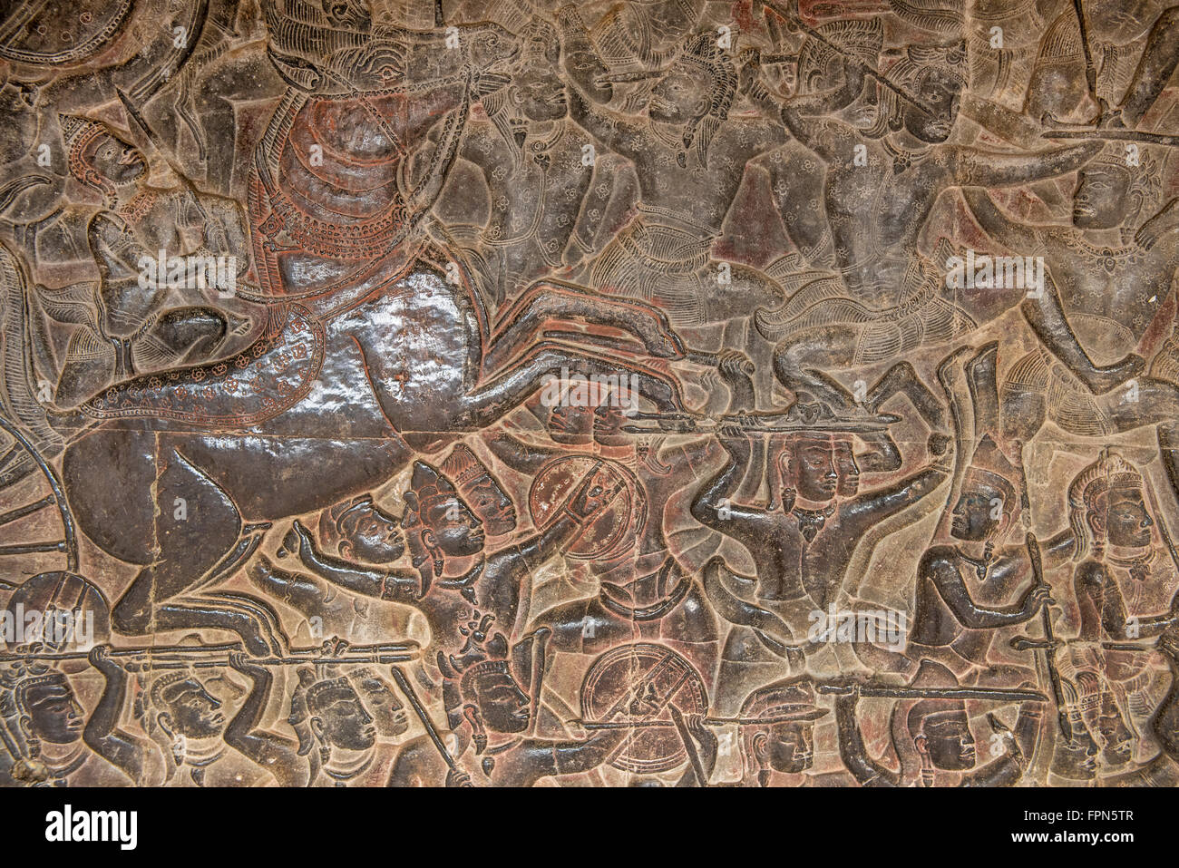 Angkhor Wat, Cambodia - January 29 2016:  Bas relief showing the  furious battle of Kurushetra with a horse rearing up and a car Stock Photo