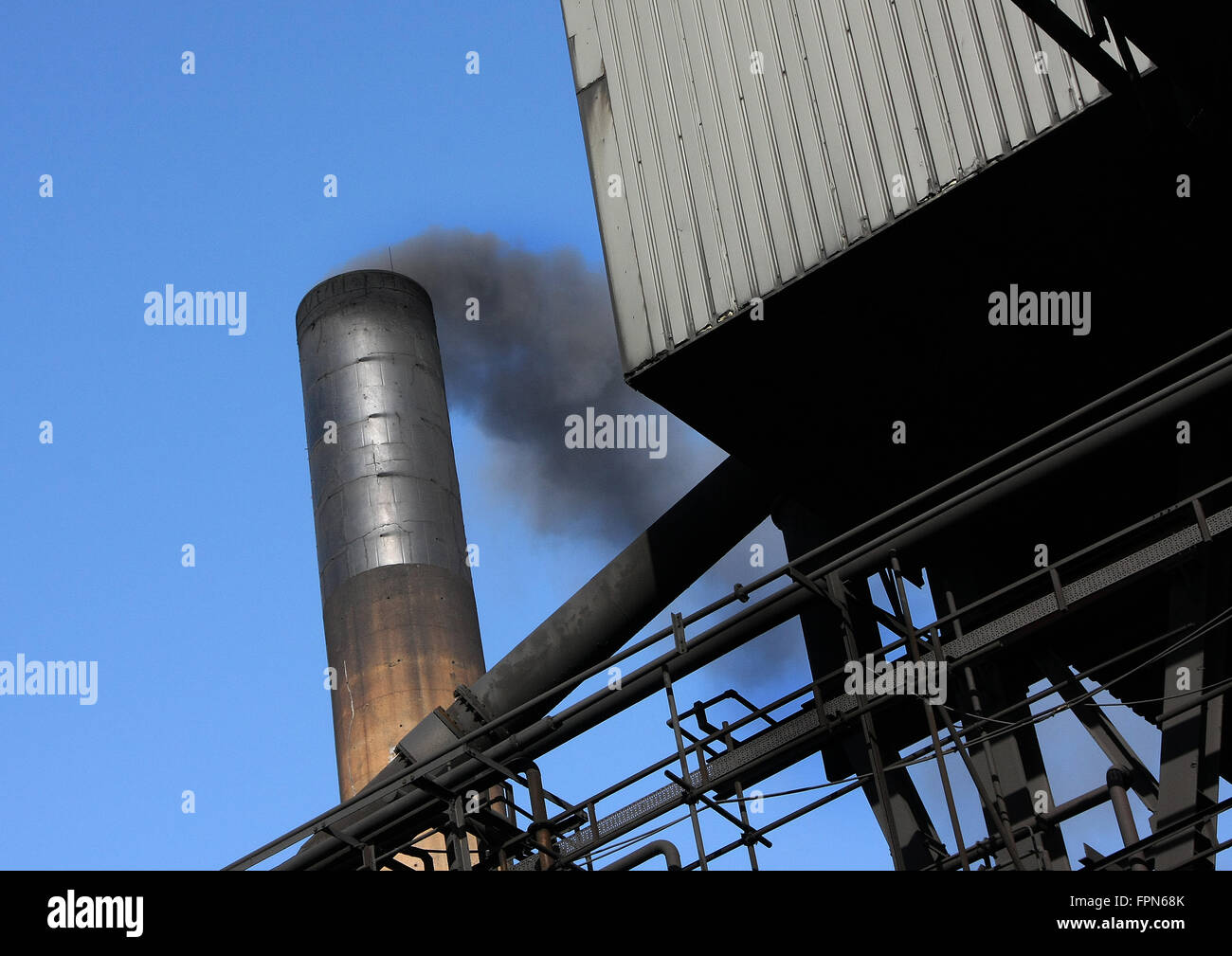 Smoke and emissions from factory chimneys. Stock Photo